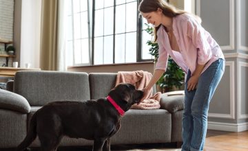 Full shot woman and dog